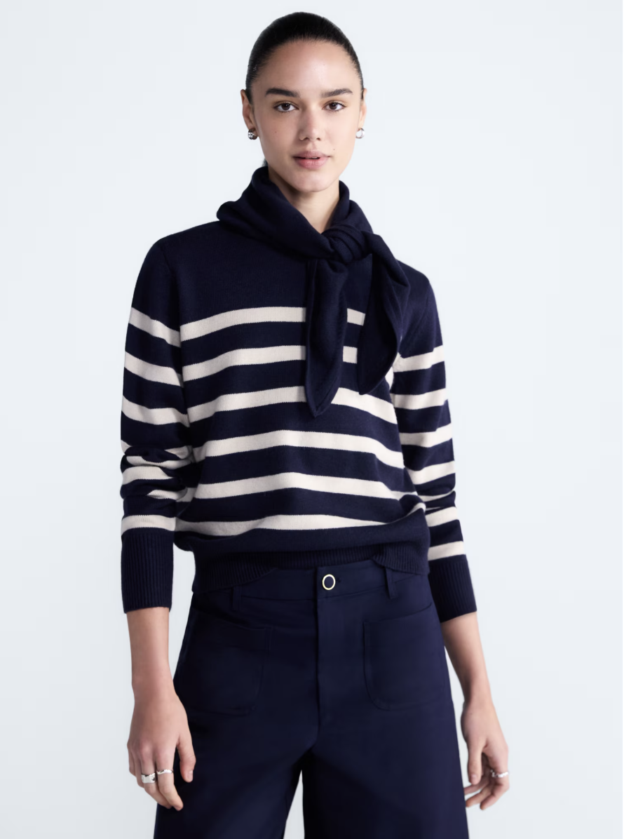 Cropped Free Assembly crewneck sweater with a matching scarf.