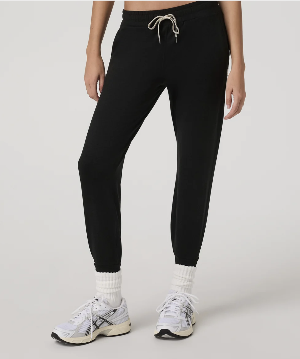 Black Vuori Performance Jogger styled with white sneakers"