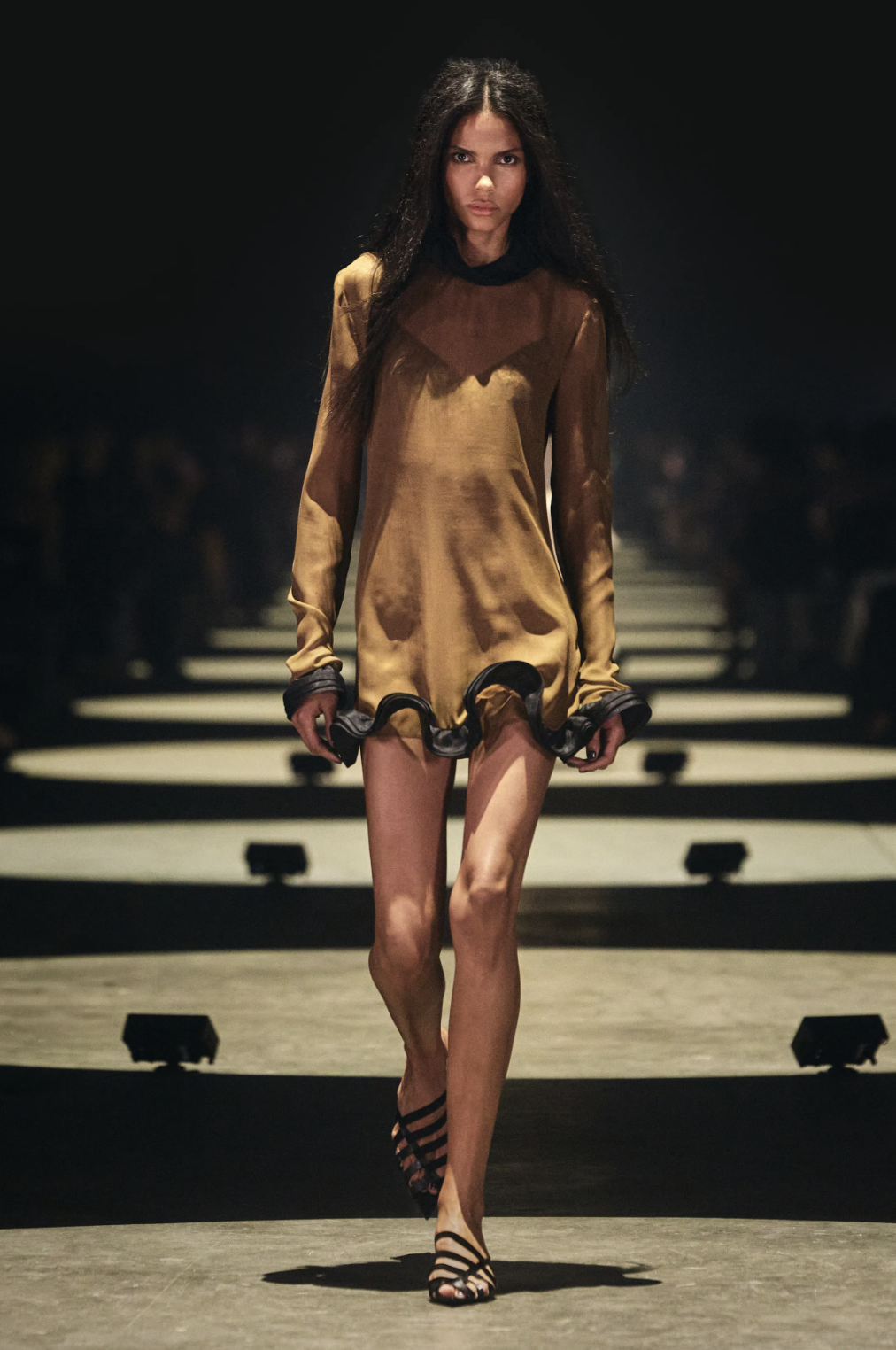 Khaite Spring 2027 runway look featuring cropped black skinny trousers