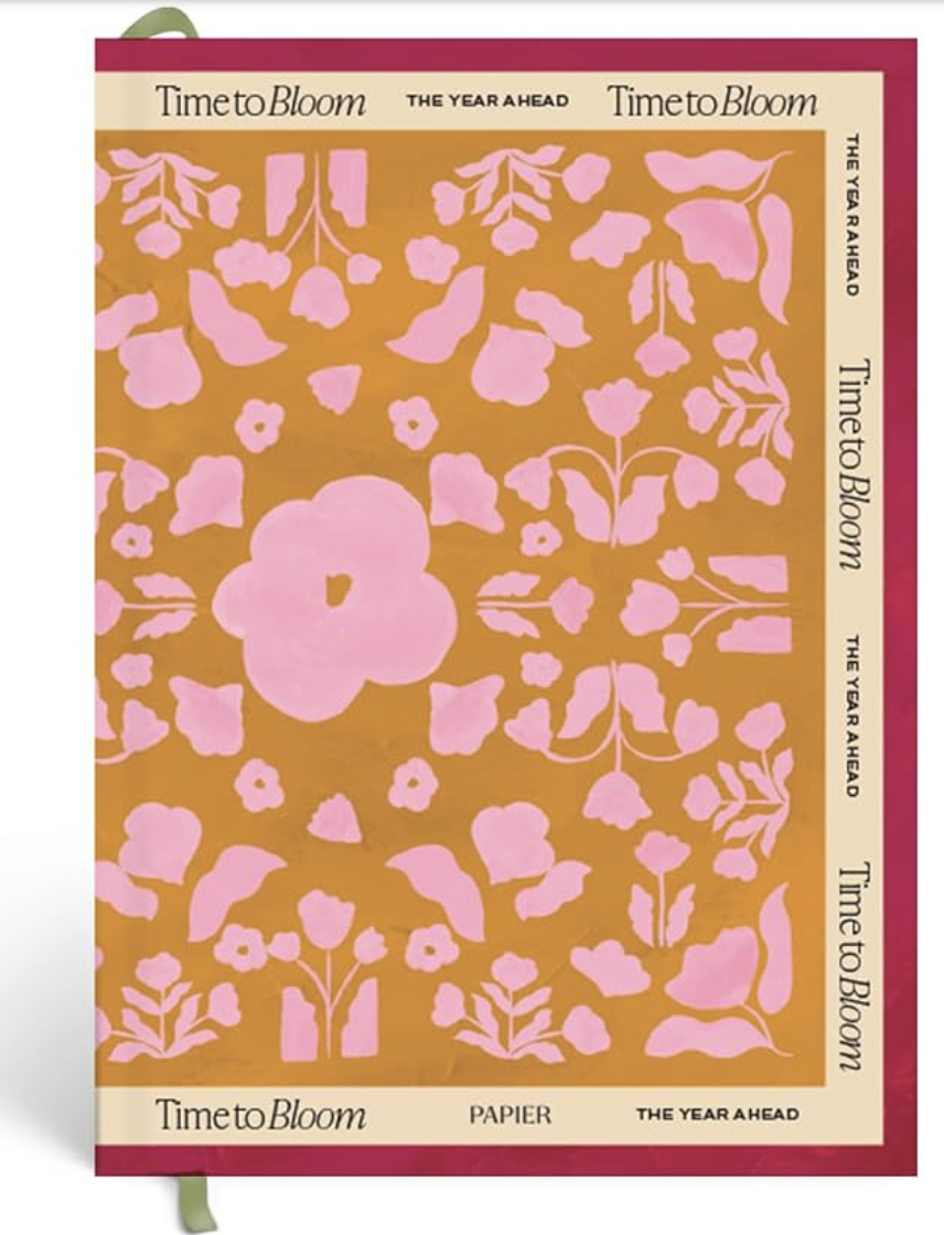 Blush spiral-bound undated planner with gold binding