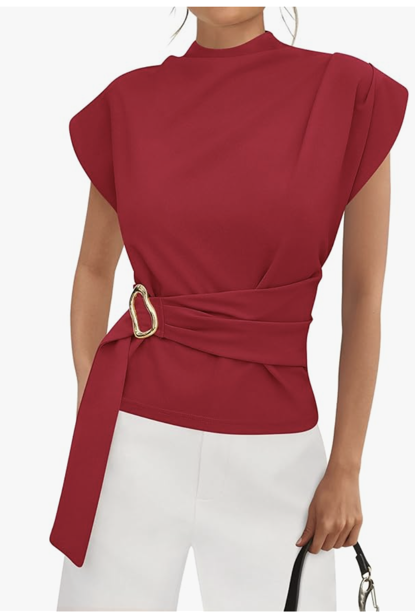 Fashion editor wearing a cherry red cap sleeve mock neck shirt tucked into white trousers, demonstrating a 2026 tonal outfit formula.