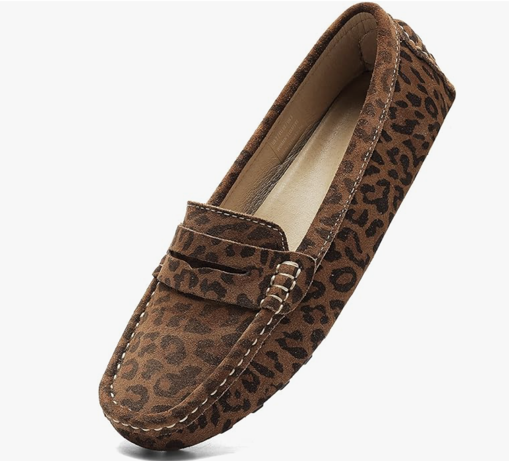 A pair of brown and black leopard print suede penny loafers for women, an animal print footwear staple for a business casual capsule wardrobe.