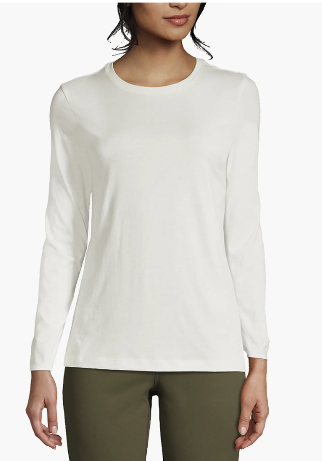 Woman wearing a soft ivory Lands' End long-sleeve crewneck tee with olive pants.