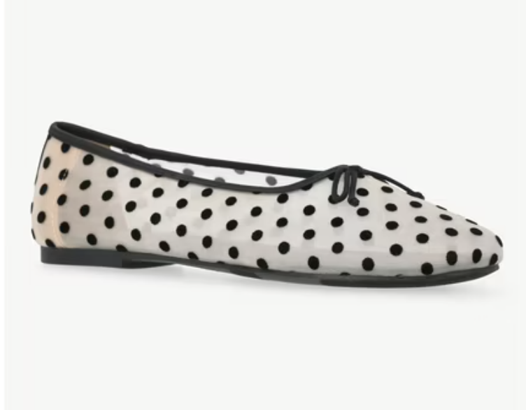 A pair of cream mesh ballet flats featuring a black polka dot pattern and a dainty bow detail, displayed as a trendy and breathable footwear option for summer.