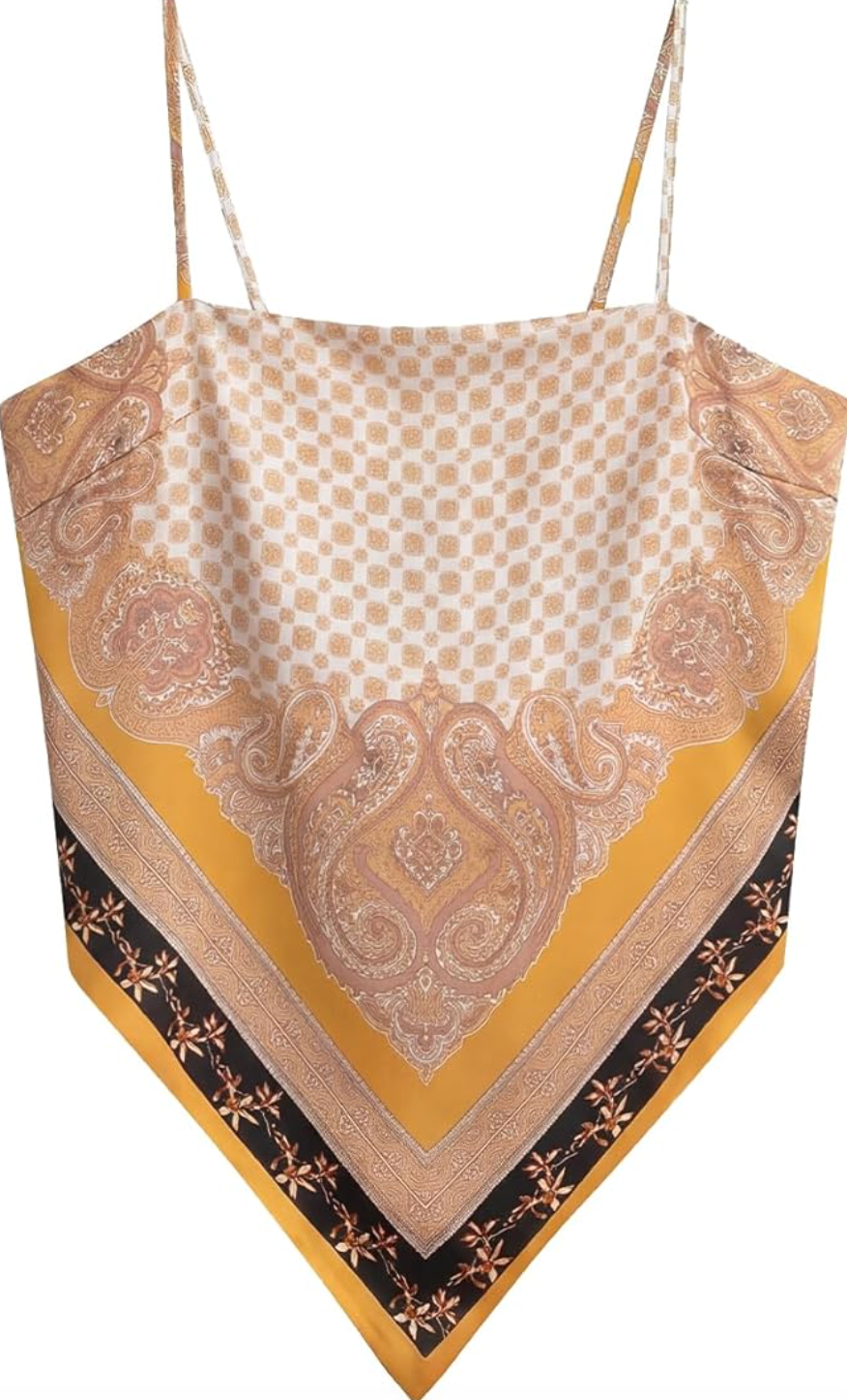 Close-up of a gold and cream paisley print satin bandana tube top with thin spaghetti straps.