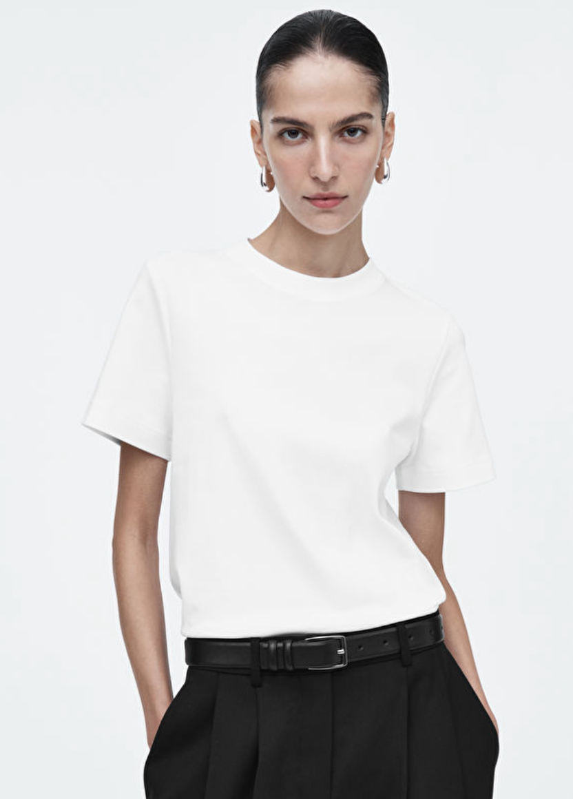 Woman wearing the COS Clean Cut white t-shirt, a heavyweight and structured opaque tee perfect for professional work outfits.