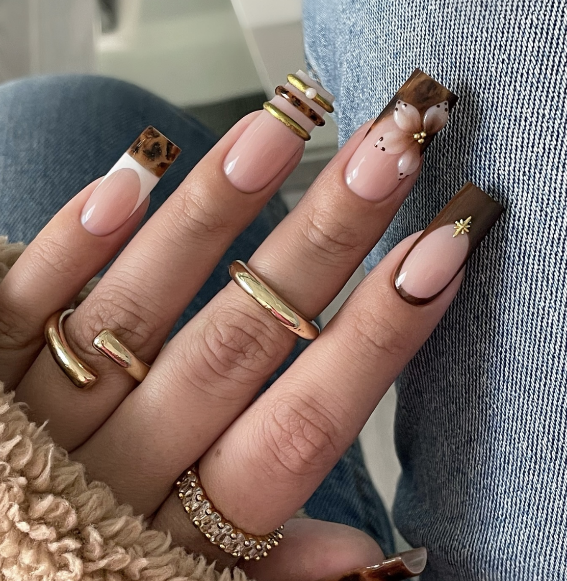 Square nude nails featuring chunky 3D molten silver chrome bands and industrial metallic textures.