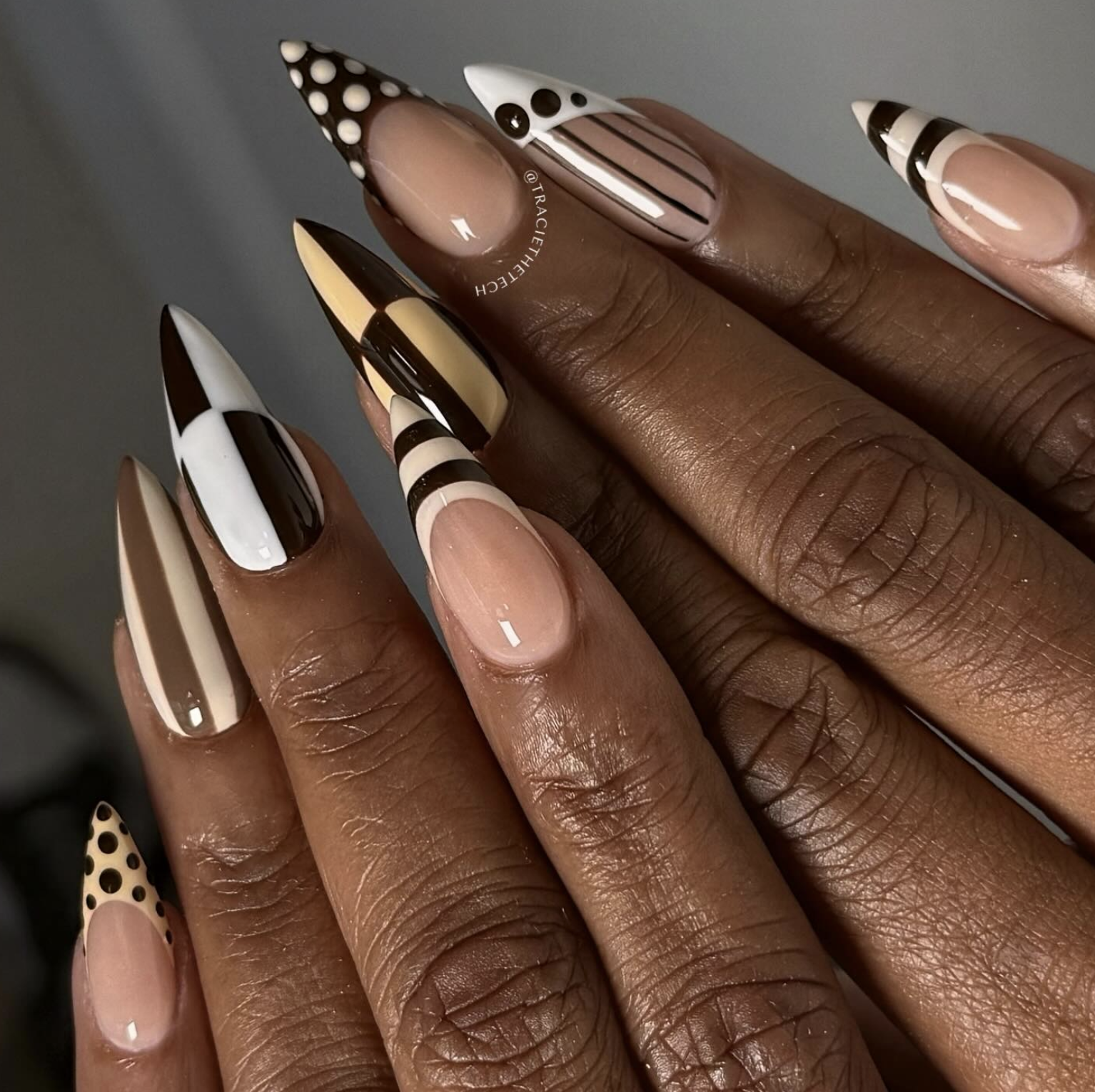 Chocolate brown and cream color-blocked nail design on short square nails