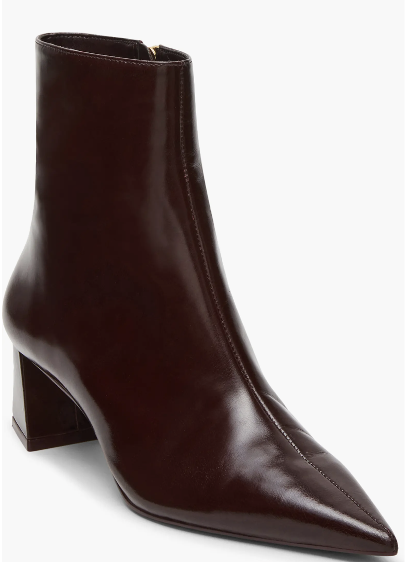 A fashion editor-approved guide on what shoes to wear with cropped pants, featuring dark chocolate brown Steve Madden Ashli pointed-toe booties with a slim shaft to create a clean line at the ankle.