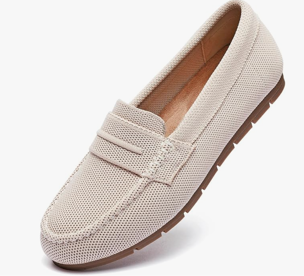 A pair of beige knit loafers with cushioned insoles, shown as a comfortable and professional footwear option for a long day at the office.