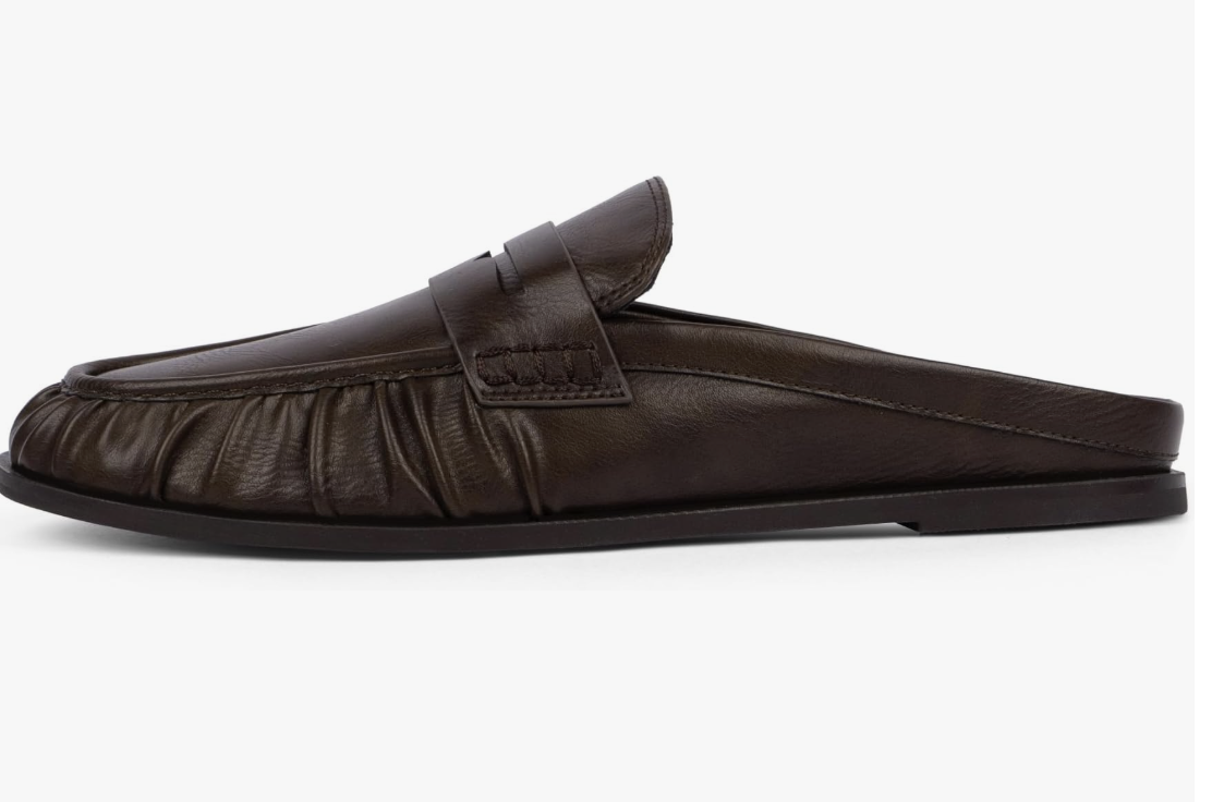 A dark brown faux-leather pointed-toe mule with a low kitten heel and gathered ruched detailing on the upper.