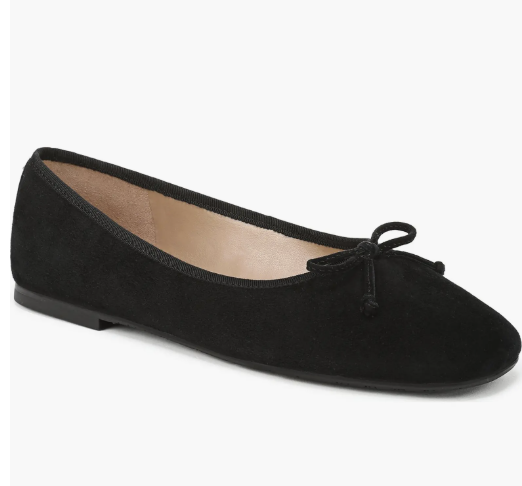 Product shot of Sam Edelman Alie black suede ballet flats with a small bow detail, featured as a sleek footwear choice to pair with baggy jeans.