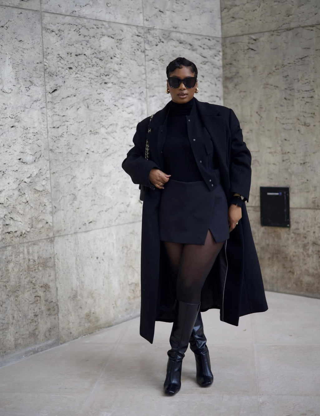 Tonal black outfit with mixed textures for fall