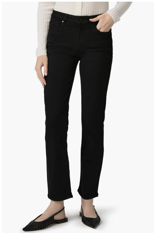 Front view of high-waisted black straight-leg jeans styled with a cream knit top and black pointed-toe mule heels.