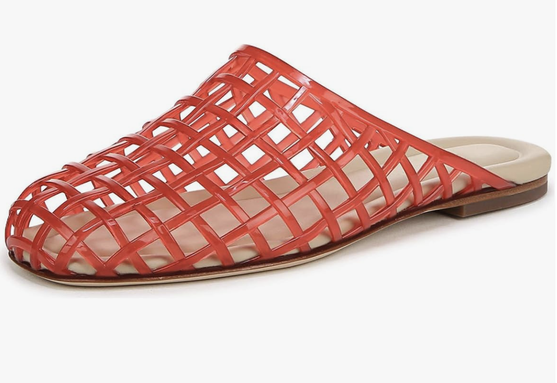 A close-up product view of a pair of bright red woven lattice jelly mule flat shoes featuring an open-back design on a white background.