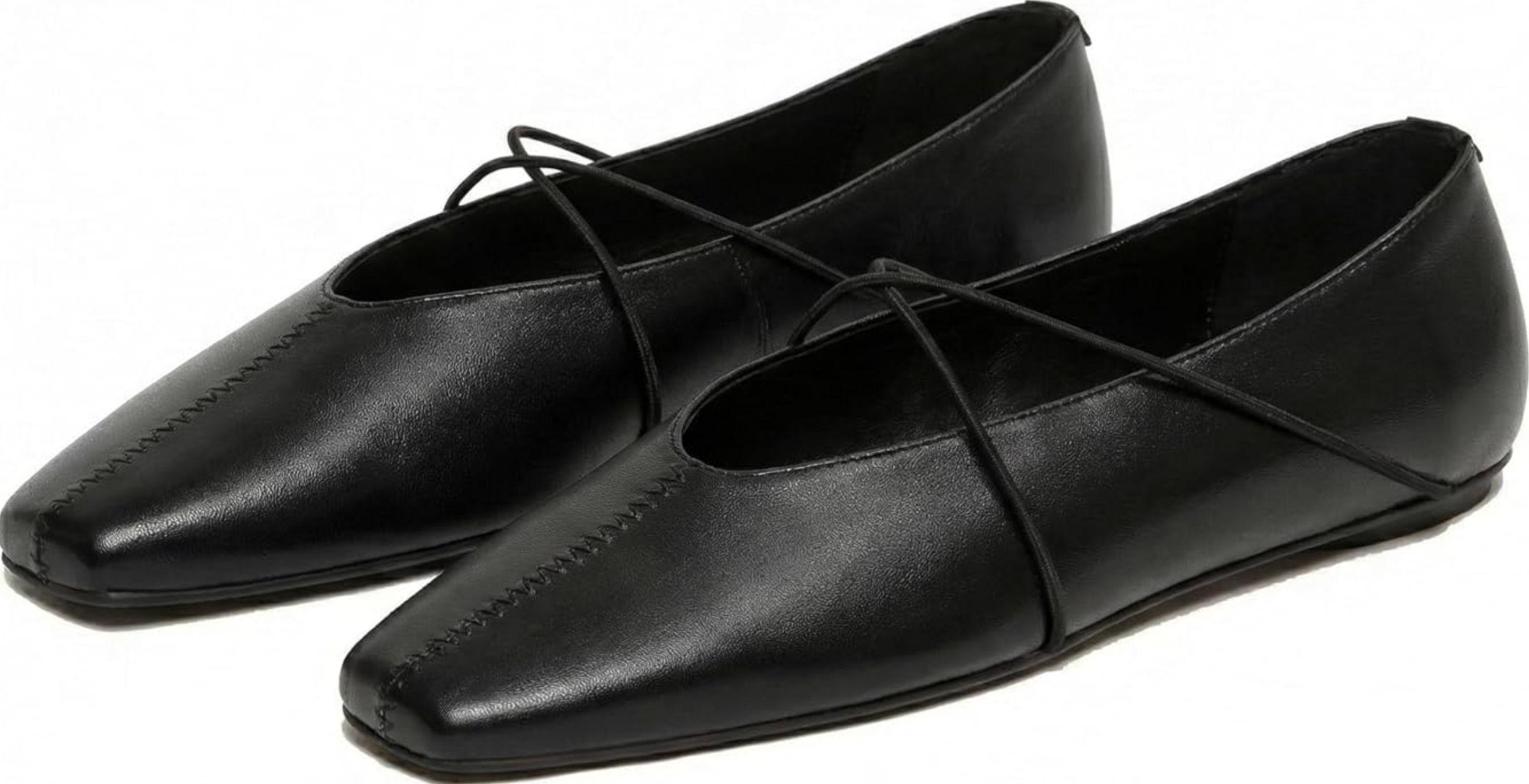 A pair of black leather square-toe ballet flats with a delicate bow detail and thin criss-cross elastic straps, styled for a chic and comfortable spring capsule wardrobe.