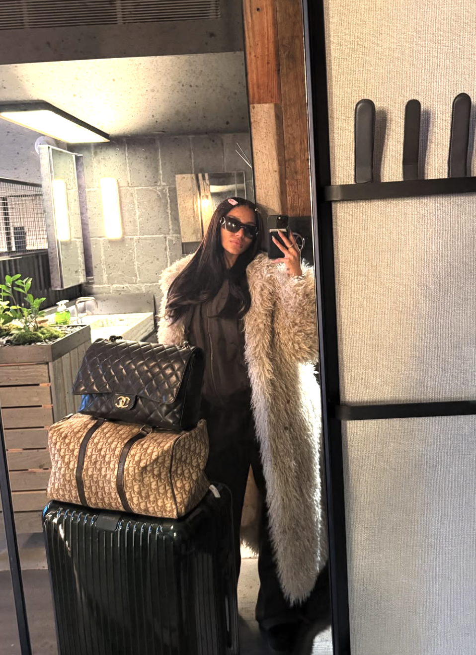 Woman packing a suitcase with beach vacation essentials including swimsuits, sandals, and summer clothing