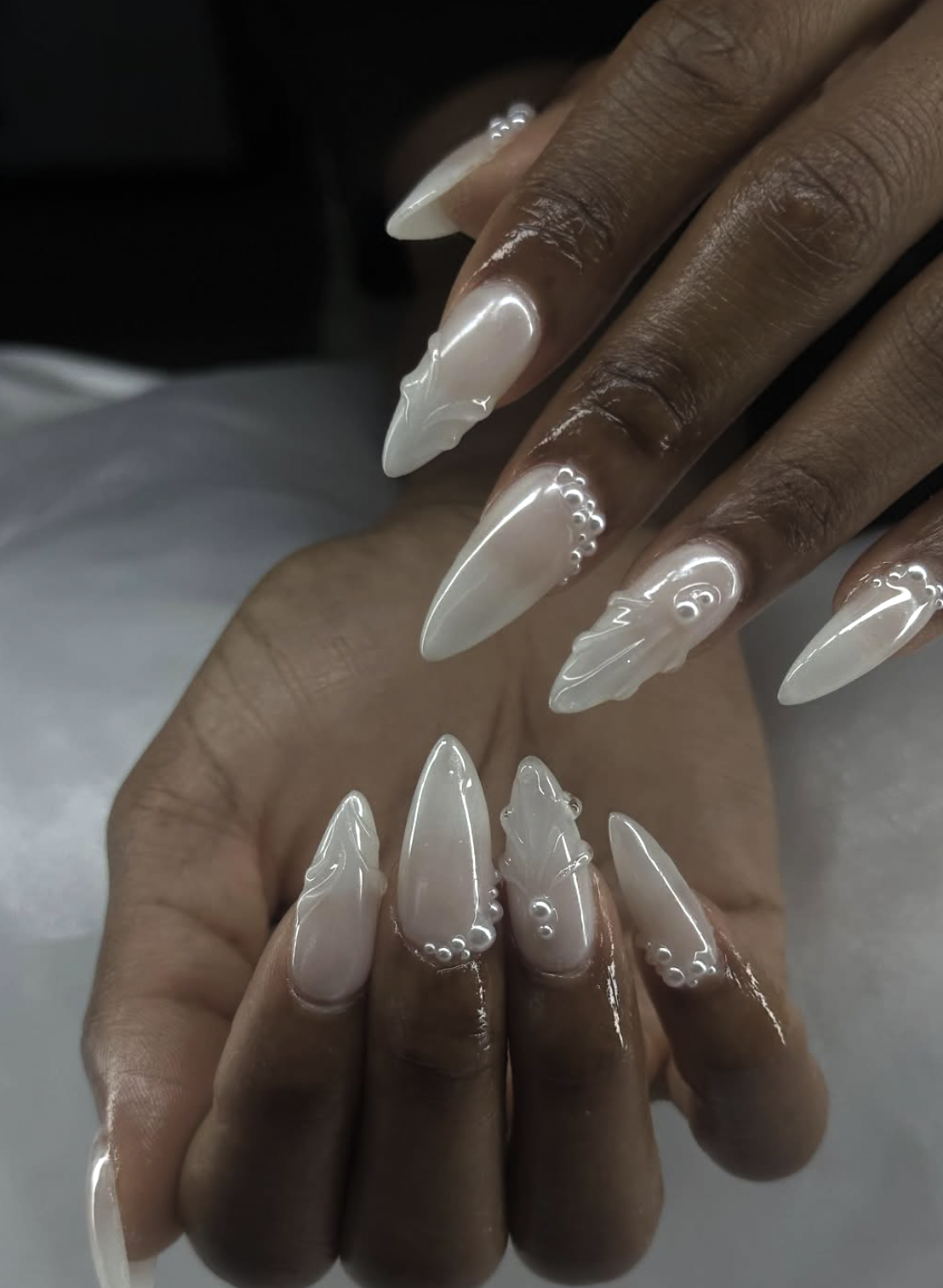 Pearl white chrome Christmas nails with a soft reflective finish