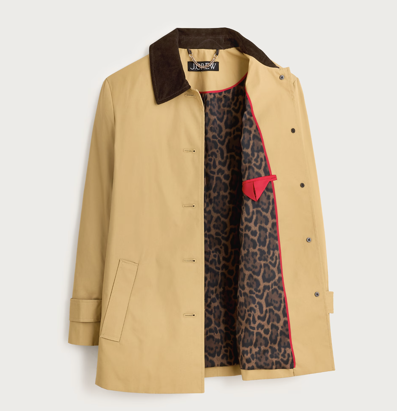 A tan J.Crew cotton canvas barn jacket featuring a brown corduroy collar, gold snap buttons, and a leopard print lining, shown as a structured trench coat alternative for petite women.