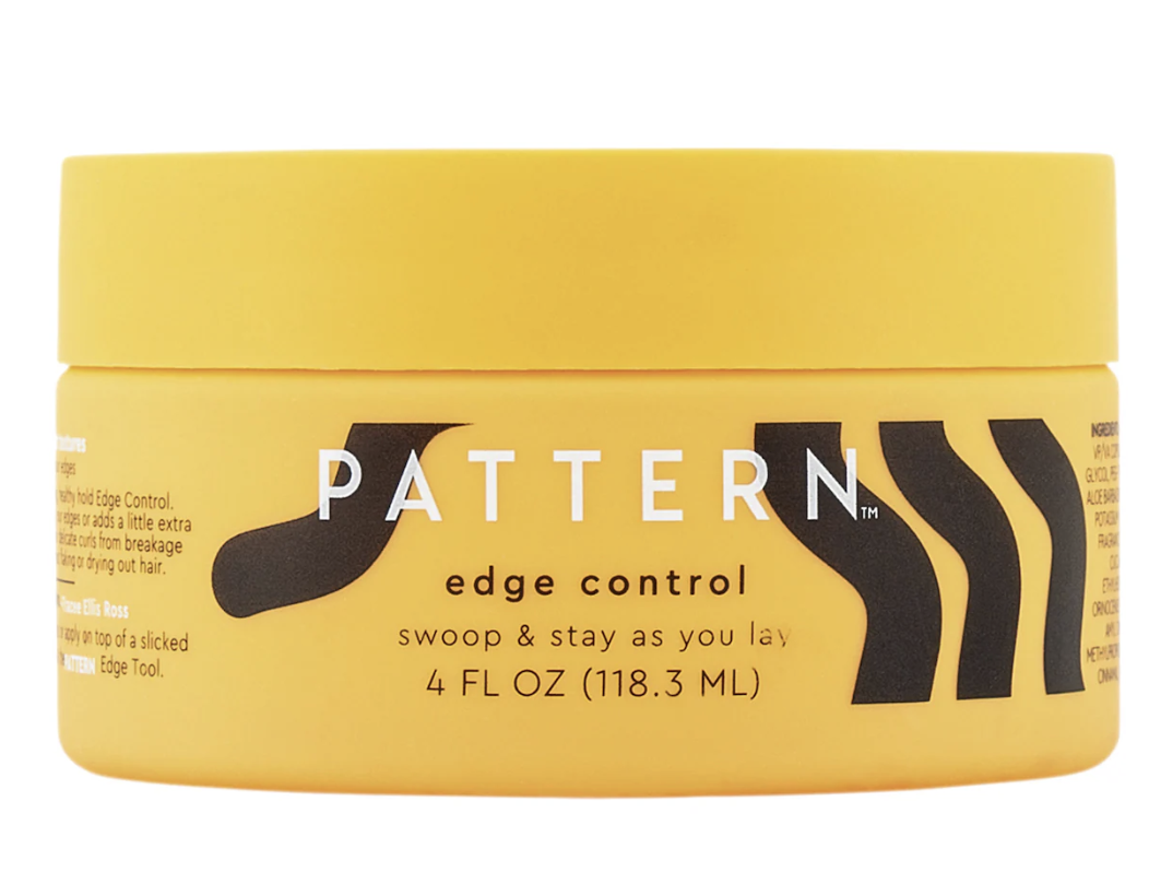 A yellow jar of Pattern Beauty by Tracee Ellis Ross Edge Control on a white background.
