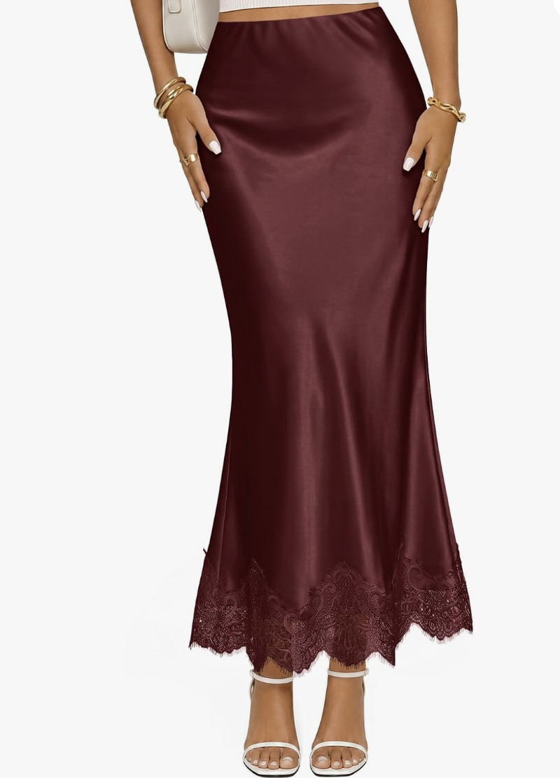 Burgundy bias-cut satin midi skirt with stacked gold bangles.