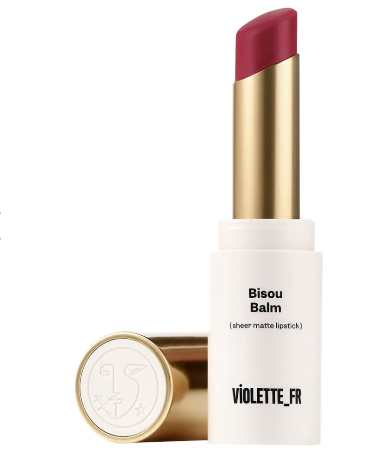 A tube of Violette_FR Bisou Balm Sheer Matte Lipstick, used to achieve the 'Just Smooched' blurred lip trend seen at the LaQuan Smith FW26 show.