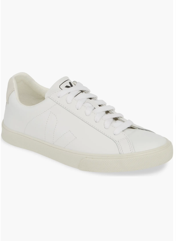 A pair of minimalist white Veja Esplar leather sneakers, a sustainable and professional choice for work sneakers and business-casual outfits.