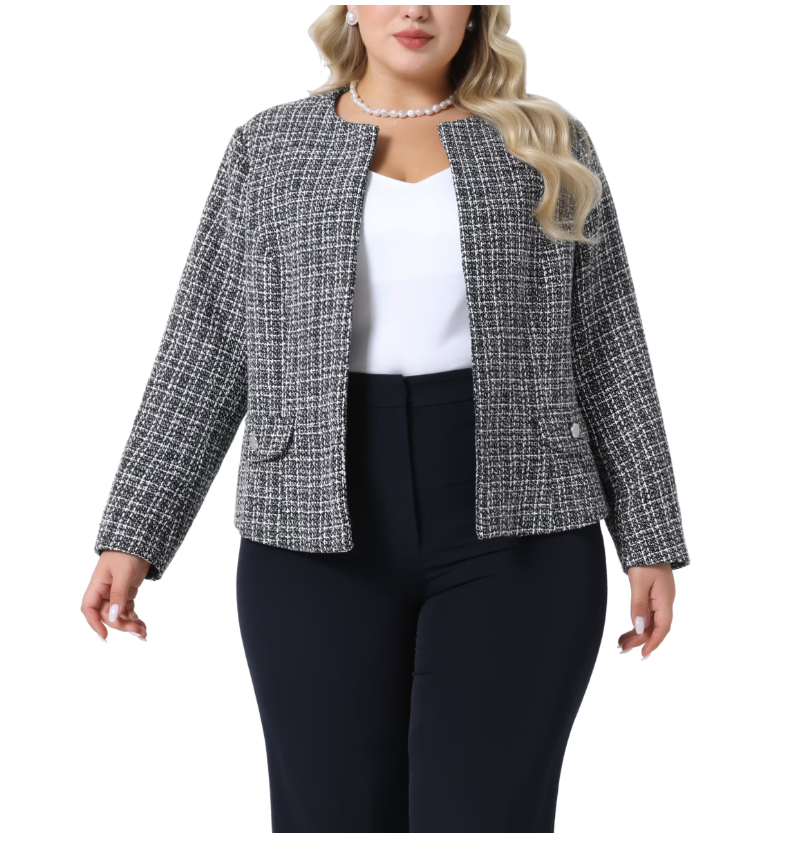 Woman wearing a black and white tweed collarless jacket over a white top with navy trousers and a pearl necklace.