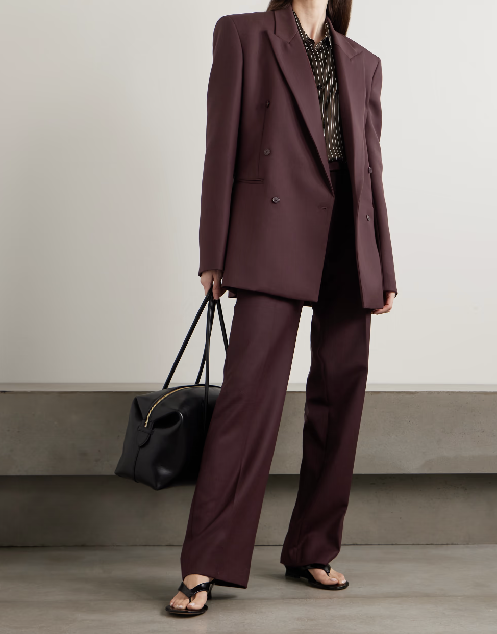 Professional style hack: The Frankie Shop Monterey oversized double-breasted blazer in a rich plum wool-blend, styled with matching trousers and black sandals for a sophisticated quiet luxury look.
