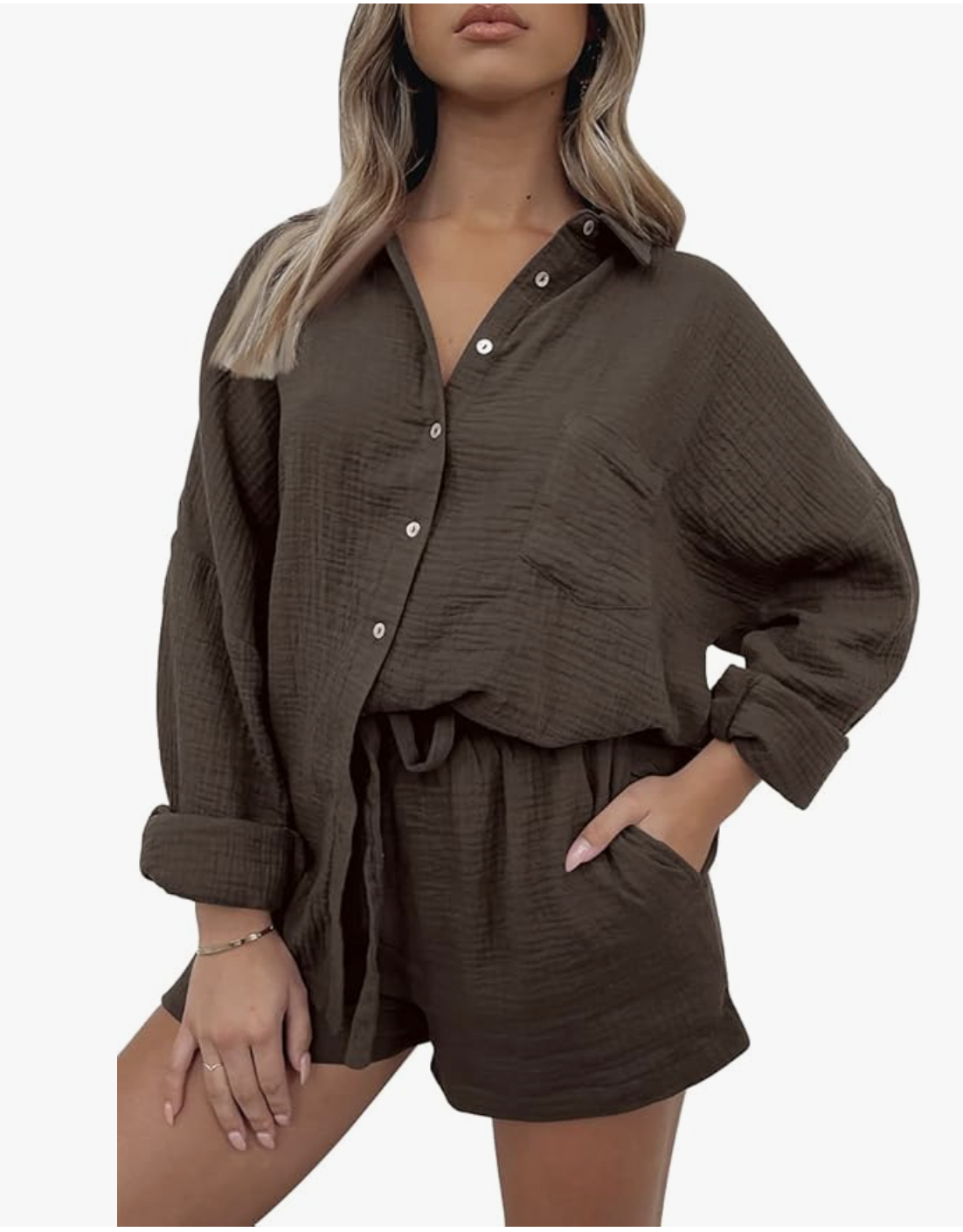 A woman wearing a brown Oversized Shirts And Short Set featuring a long-sleeve button-down shirt and matching lounge shorts, styled for a casual summer BBQ outfit.