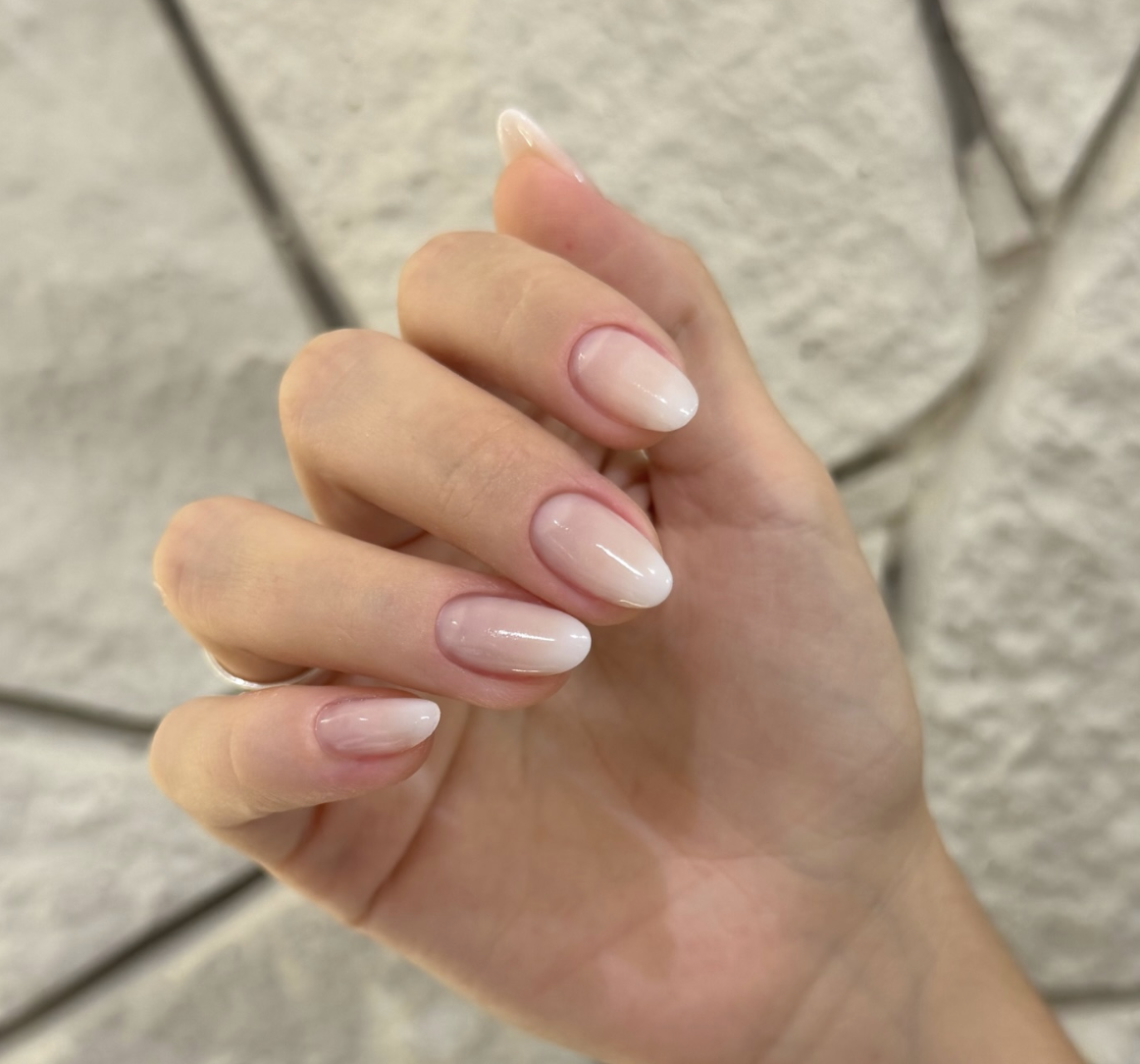 Long almond nails with a plump, semi-translucent milky white soap nail finish.
