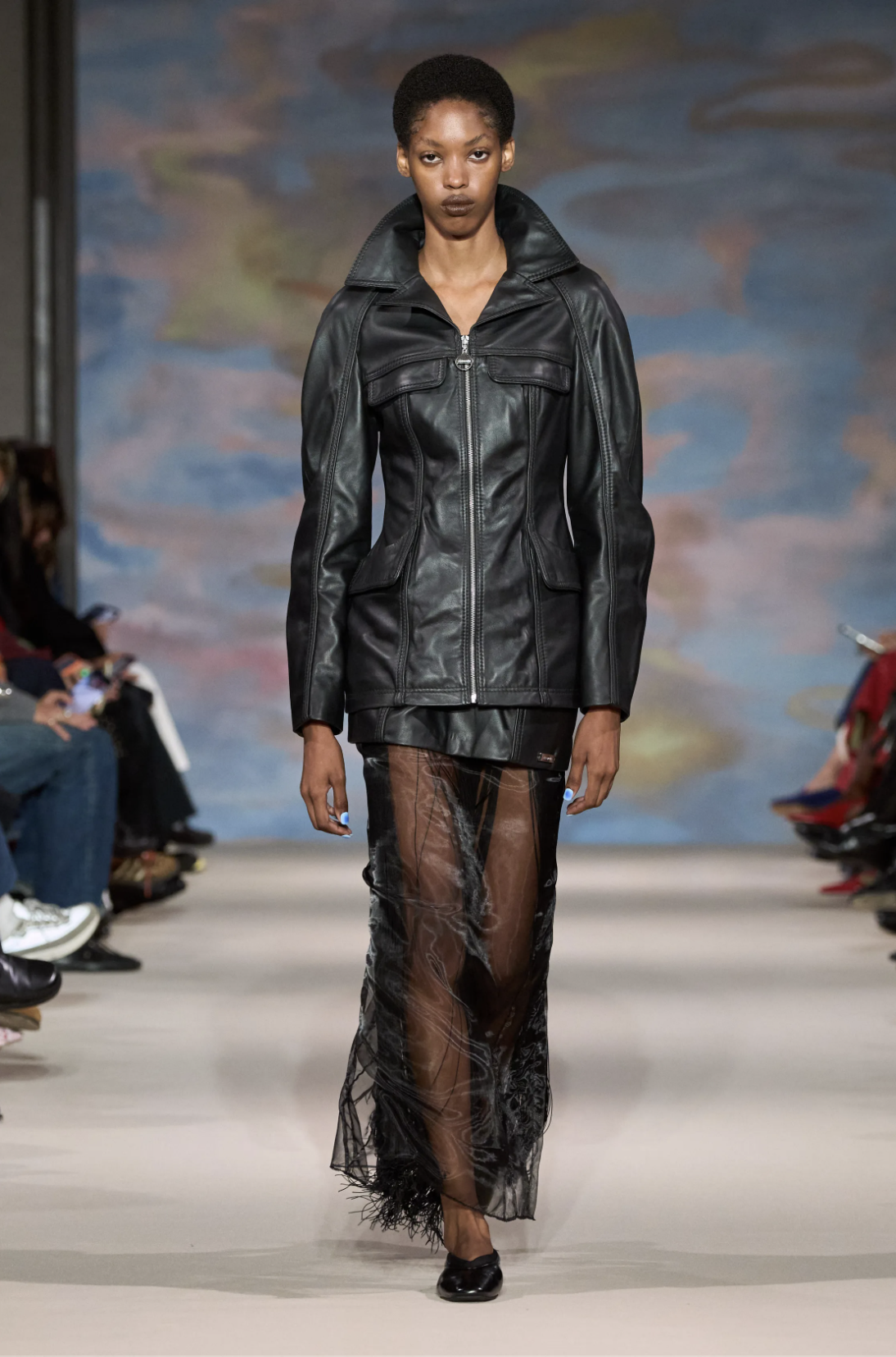 Model wears an oversized blue denim jacket and matching shorts with cobalt PUMA sneakers at Ahluwalia Spring 2027.
