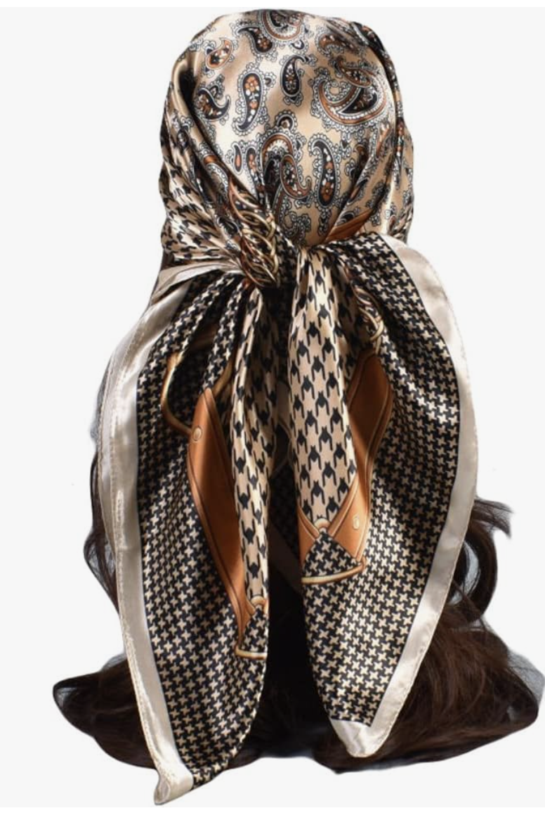 A close-up of a Large Women's Satin Square Scarf featuring a classic black and white houndstooth pattern with a contrasting tan and cream border.