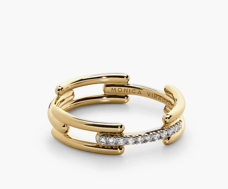 A gold Monica Vinader Signature Link Lab Grown Diamond Ring featuring a triple-band design with pavé diamonds, representing timeless quiet luxury.
