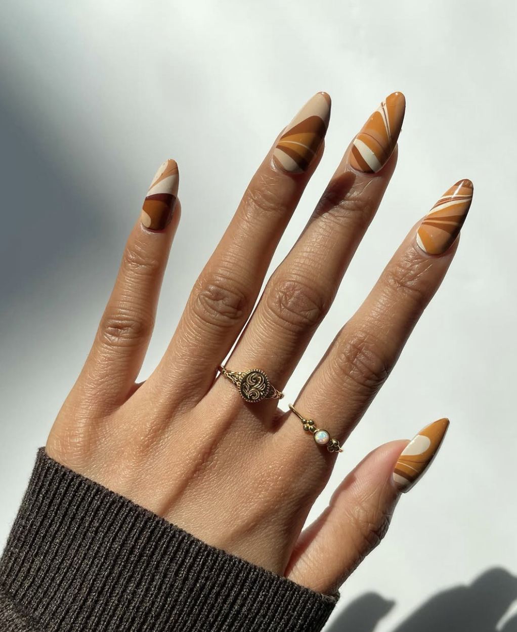 September nail idea featuring caramel swirl nails