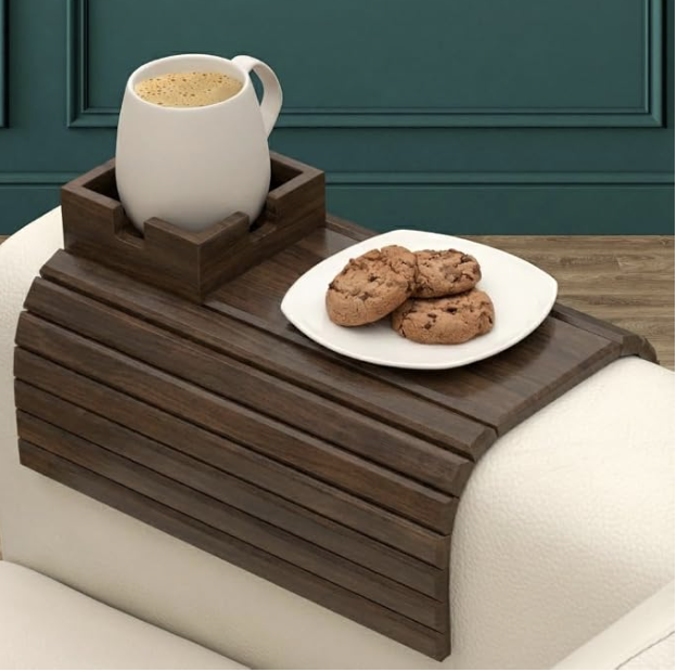 Couch-arm organizer holding a remote, glasses and charging cable