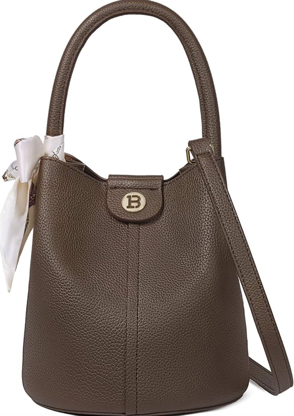 A small, structured brown pebbled leather crossbody bucket bag with a circular silver logo emblem and a white decorative scarf tied to the strap.