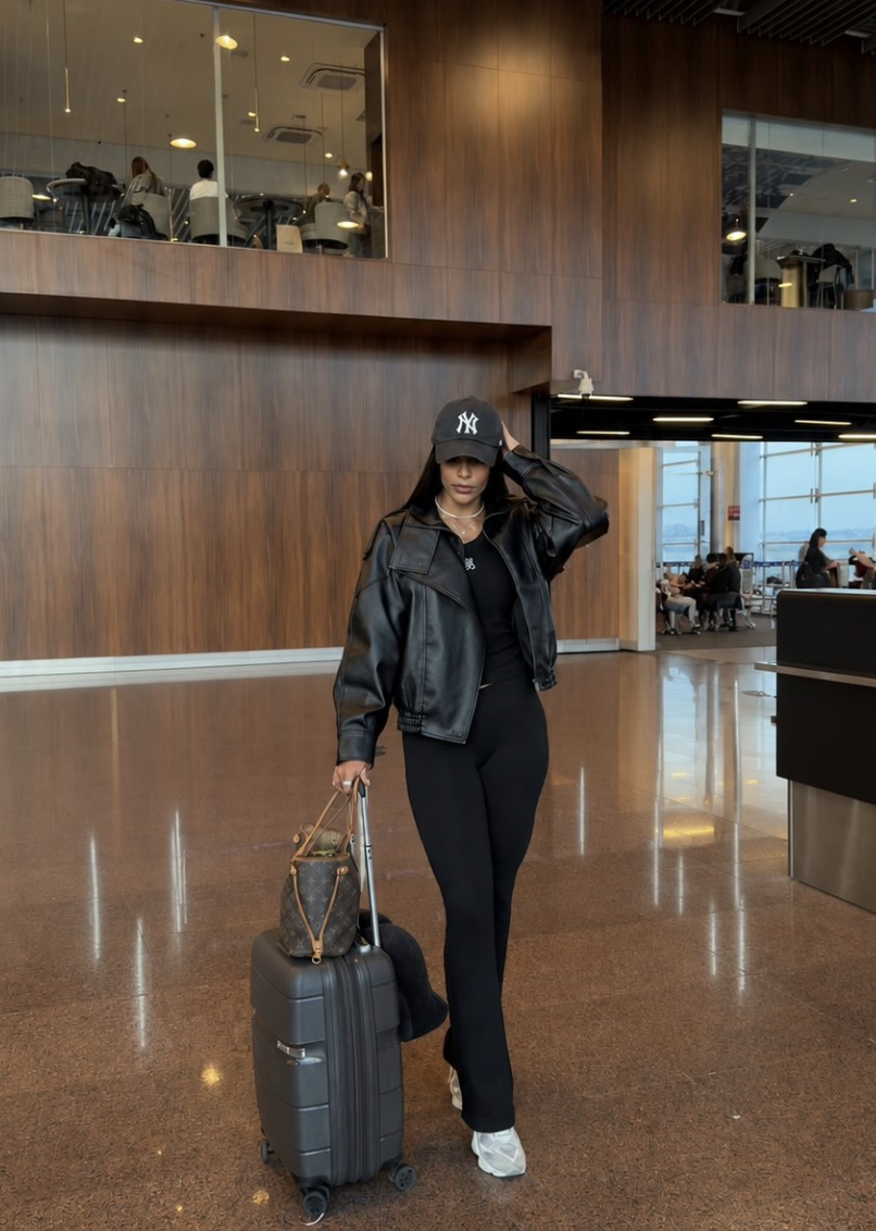 A black jacket and flared leggings.
