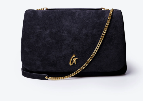 Glam-Aholic Lifestyle large black suede flap bag featuring a gold chain strap and gold hardware set against a white studio background.