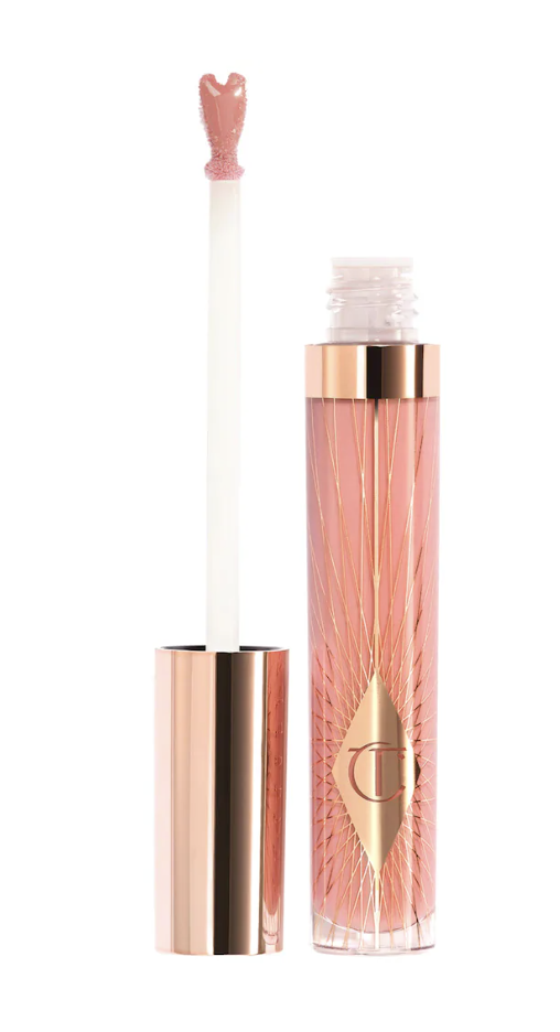 A tube of Charlotte Tilbury Collagen Lip Bath in the shade Pillow Talk Fair, showcasing its clear packaging and signature heart-shaped wand applicator.