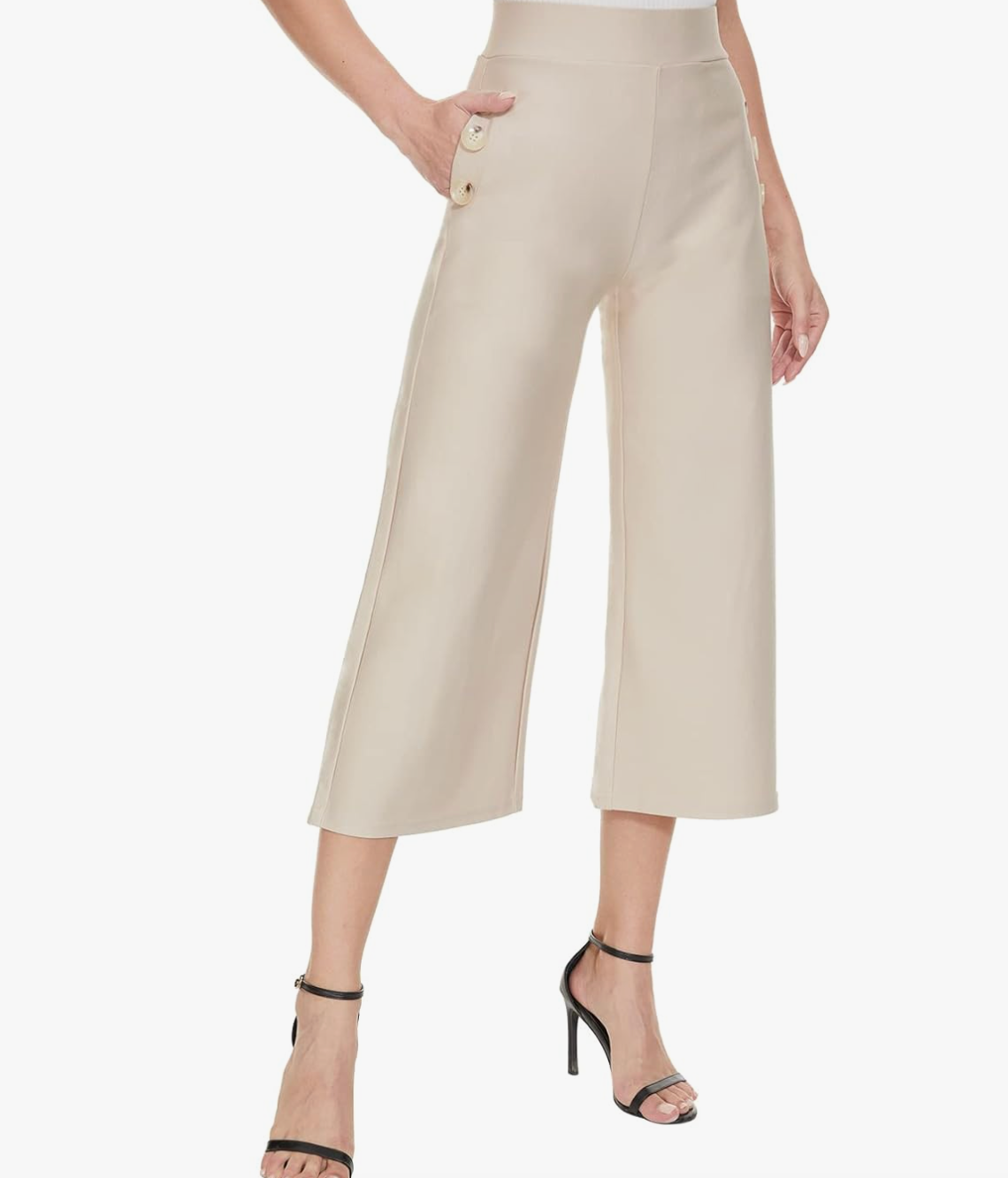 A pair of beige high-waisted wide-leg cropped capri pants with a button detail on the pocket, styled for a business casual spring outfit for women in their 50s.