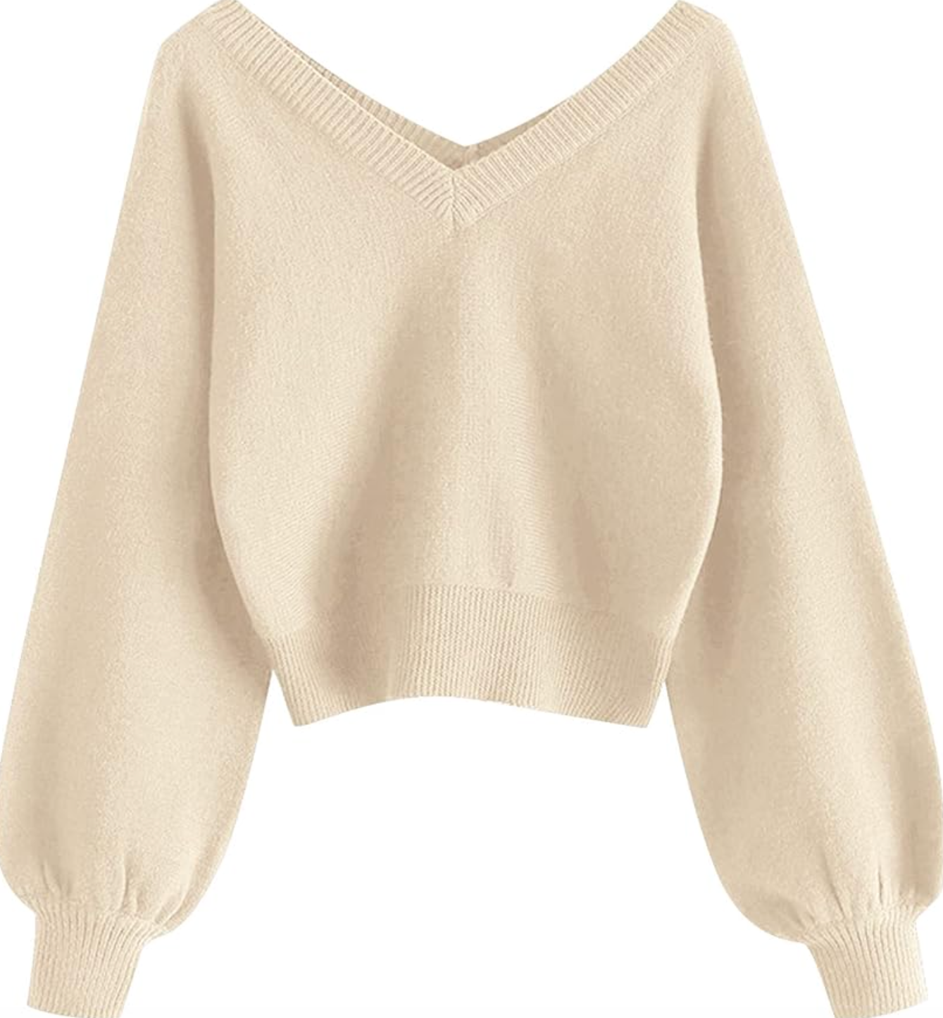 A woman wearing a light beige cropped crewneck sweatshirt with high-waisted straight-leg jeans and white sneakers, holding a coffee.