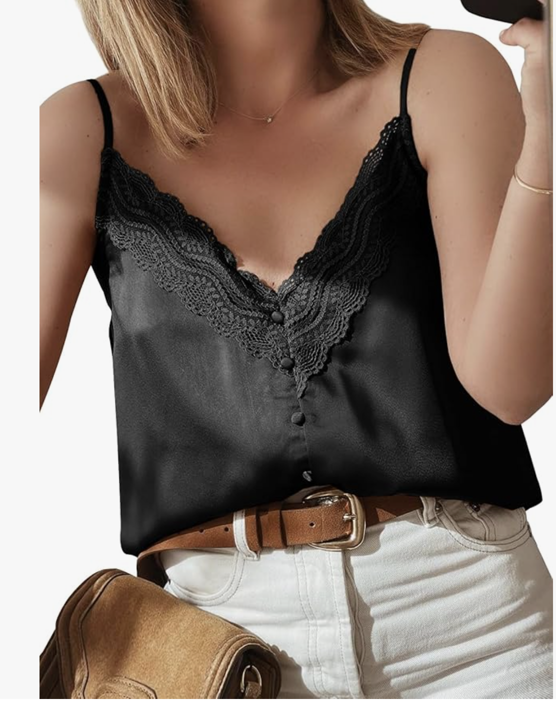 A woman wearing a black Satin V Neck Lace Trim Buttoned Cami with delicate lace detailing and small front buttons, tucked into white pants with a brown belt for a summer BBQ outfit.