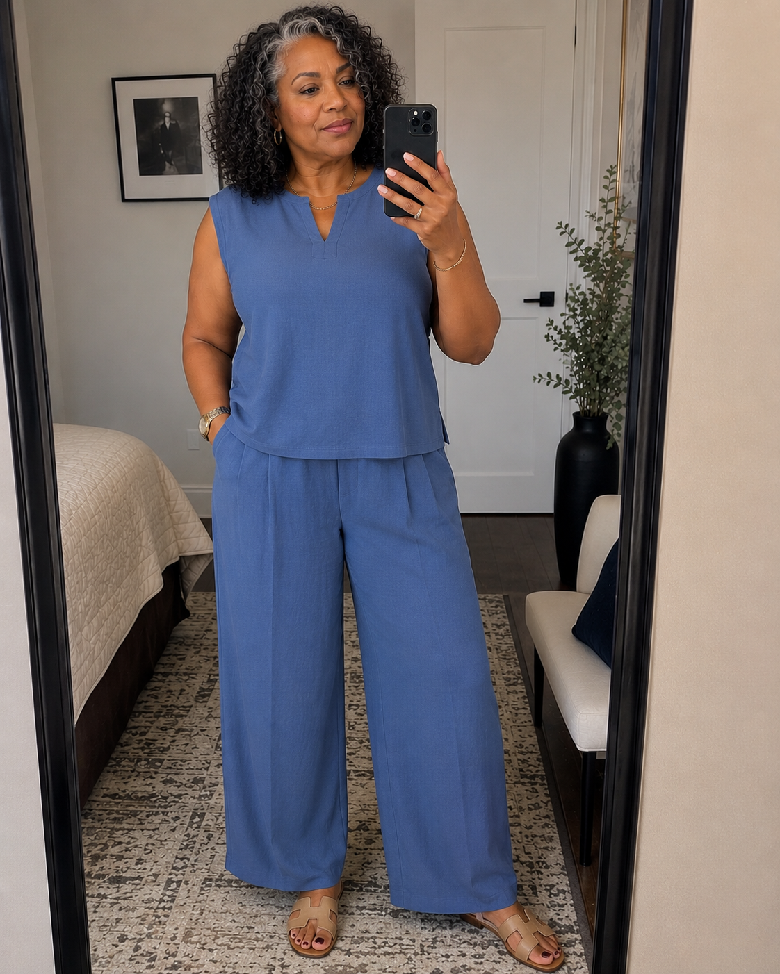 Woman in a fitted top and straight-leg trousers showing her natural body proportions