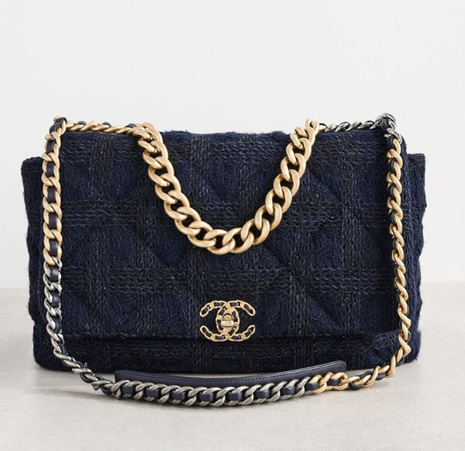 Shopbop Archive pre-owned Chanel 19 Maxi flap bag crafted in dark navy blue tweed featuring woven leather chain hardware and classic CC turn-lock closure.