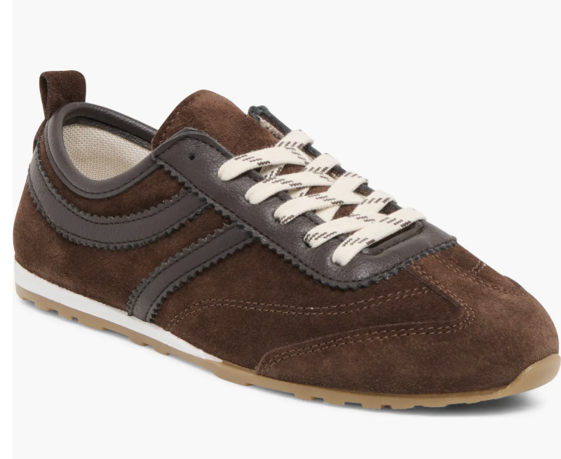 A pair of chocolate brown suede sneakers with a low-profile silhouette, ideal for professional outfits with sneakers and midi skirts.