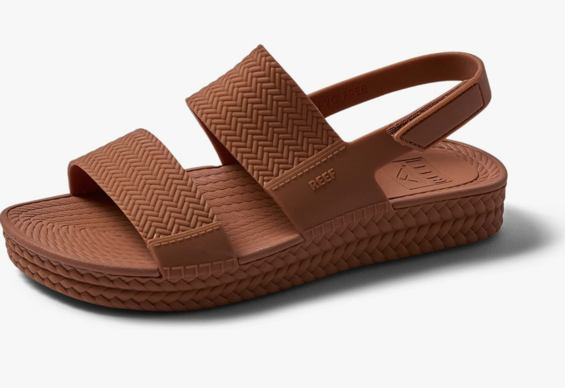Reef Women's Water Vista Sandals in Tan featuring a dual-density EVA footbed, espadrille-inspired woven texture, and an adjustable velcro backstrap for a secure fit.