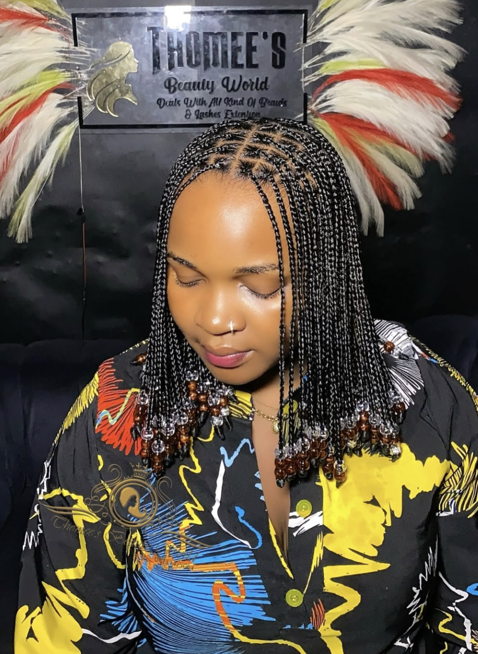 Short braided bob decorated with lightweight beads.