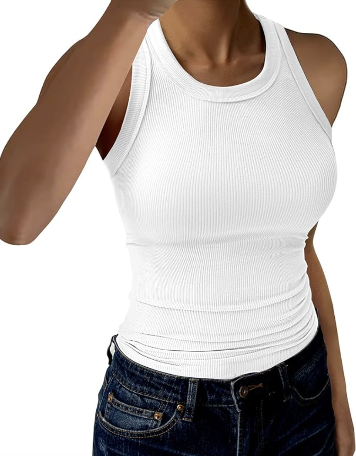 A close-up of a woman wearing a crisp white ribbed tank top tucked into dark-wash blue jeans.