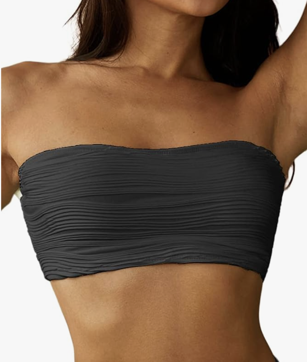 A close-up of a woman wearing a charcoal grey strapless bandeau bikini top with a ribbed texture and a secure, non-slip fit.